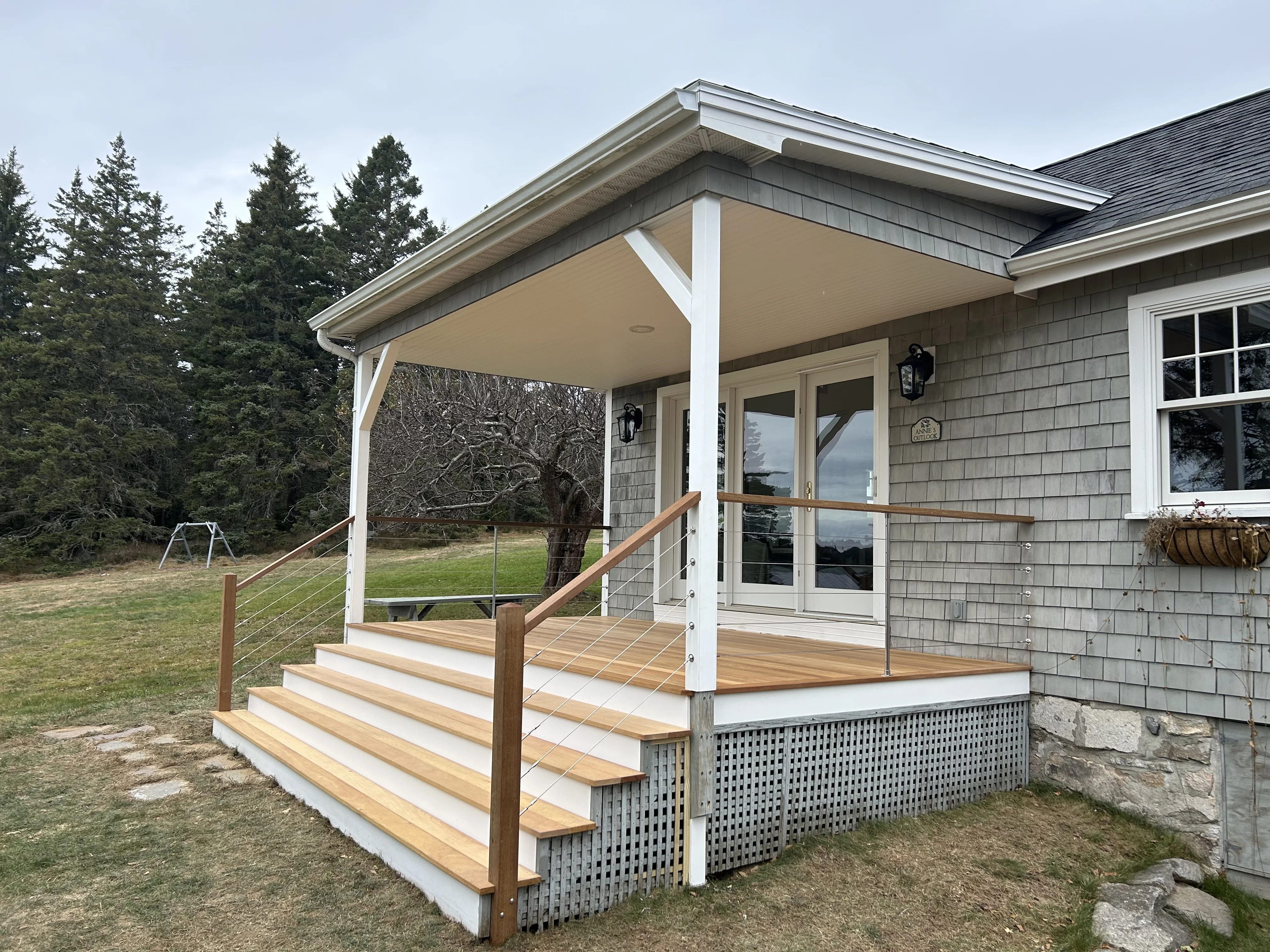 Bass Harbor porch restoration — Garapa deck, cable rails, coastal Maine